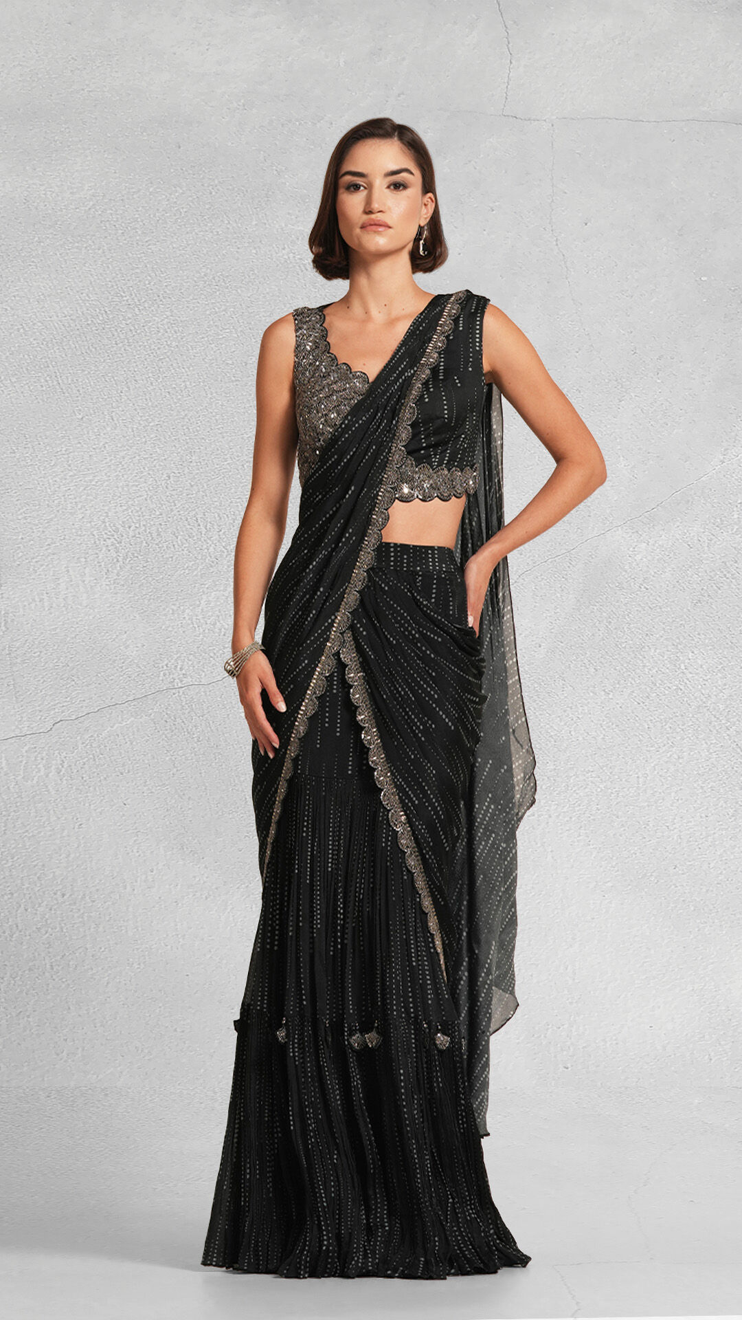 A woman flaunting her black sequin saree